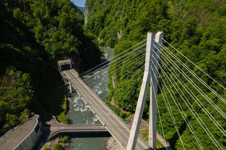 Cable-Stayed Bridge on the Adler-Krasnaya Polyana motorway. Aerial view of car driving along the...