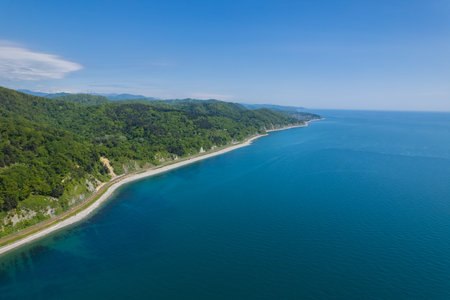 The Zubova Schel Viaduct is a road bridge, Dzhubga - Adler federal road. Aerial view of car driving along the winding mountain road in Sochi, Russia.の写真素材