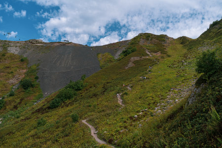 Alpine Meadows Trail, Krasnaya Polyana Resort. Alpine Meadows Walking Route. Aerial view of the green mountain valley, surrounded by high mountains.の写真素材