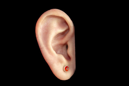 human ear isolated on black background