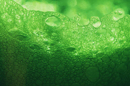 closeup of beer bubbles on white background