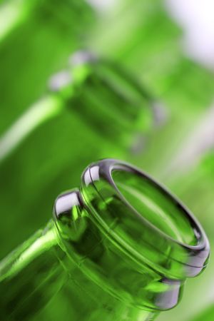 Empty green bottles in a rowの写真素材