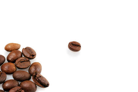 concept of loneliness,one coffee bean separated from the restの写真素材