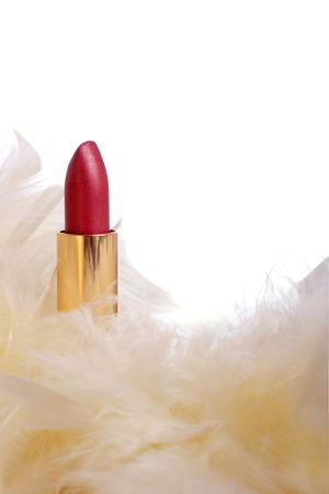 deep pink lipstick with cream feathersの写真素材