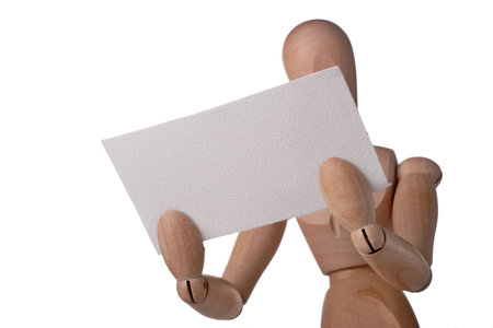 mannequin holding up blank cardの写真素材