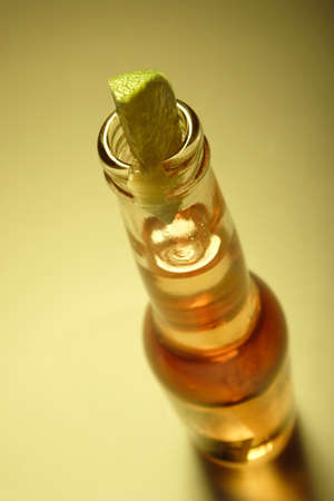 beer and lime, focus being on lime. Shallow depth of field.の写真素材