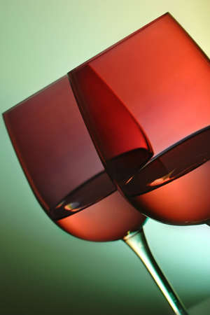two red wine glasses with ambient lightingの写真素材