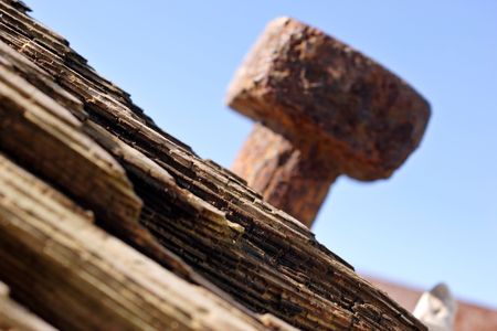 old rusty beach groyne, focus on wooden timberの写真素材
