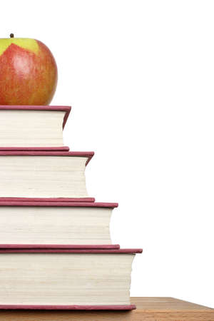 stack of books with an apple on topの写真素材