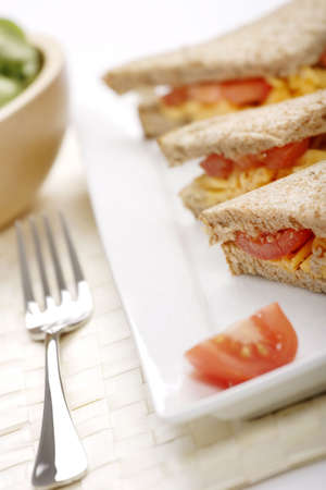 cheese and tomato sandwich with green saladの写真素材