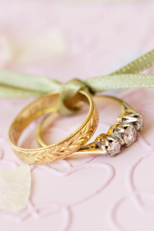 engagement ring and wedding ring, entwined together.の写真素材