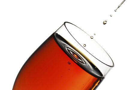 glass of sherry with a splash and dripsの写真素材