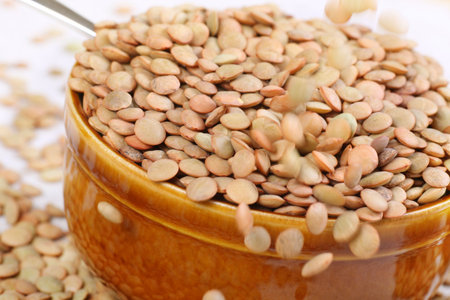 bowl full of green lentils. A good source of protein.の写真素材