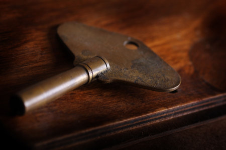 worn antique clock keyの写真素材