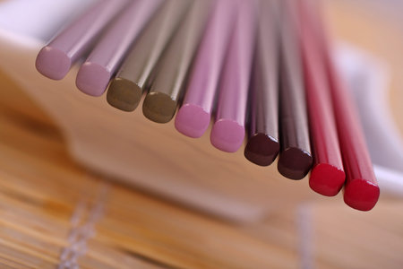 Oriental table setting, showing variety of chopsticks. の写真素材