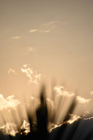 Sunset, sunrise with clouds, light rays and other dramatic effect.の写真素材