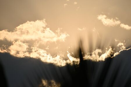 Sunset, sunrise with clouds, light rays and other dramatic effect.の写真素材