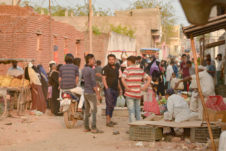 Hyderabad, India  March 05: Men sell vegetables in a street market in a Rohingya refugee camp at...