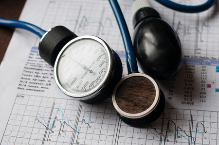 Concept medicine protection of health. Stethoscope and tonometer on the form with medical analysis, close-upの写真素材