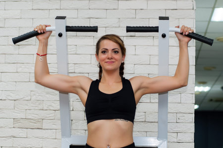 Beautiful sporty fitness woman is engaged in a sports hall. Concept body success and goal...