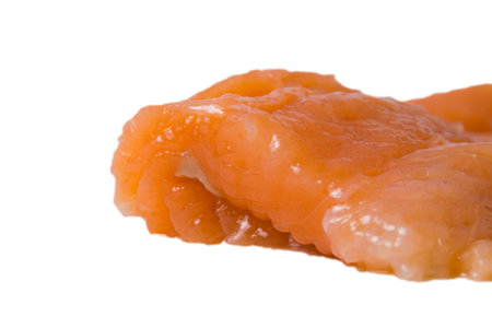 Red fish on a white background. Delicious lightly salted salmon isolate on white background with...