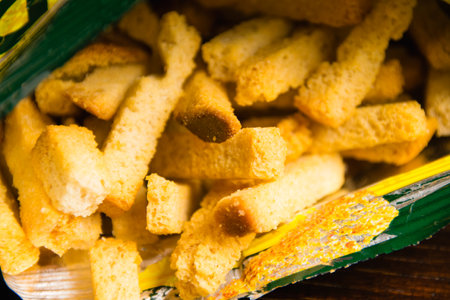 Salty snacks in foil packaging. Close up of white bread crackers.の写真素材