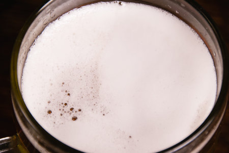 Beer foam macro, tasty beer in a beer glass.の写真素材