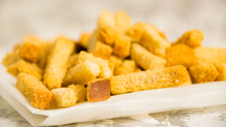 Fragrant salty crackers from rye bread on a light background. A tasty snack for beerの写真素材