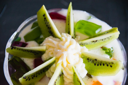 Delicious dessert with fruits. Fruit jelly with kiwi.の写真素材
