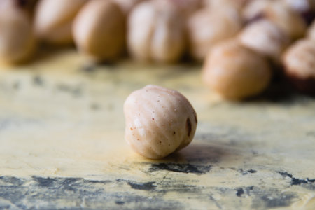 Hazelnut close-up macro and many tasty nuts in the background.の写真素材