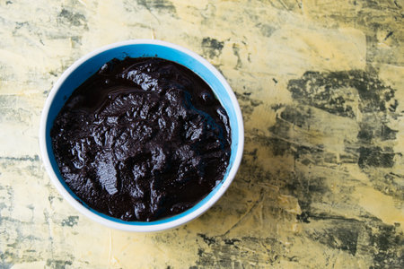 Flatlay, chocolate paste in a bowl on a light background with copy space.の写真素材