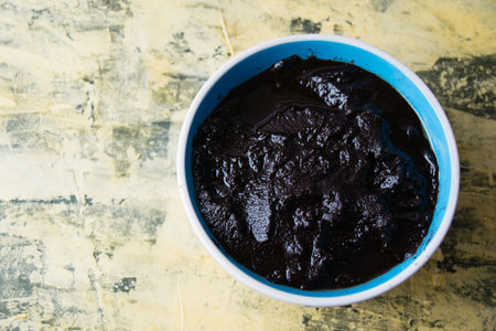 Flatlay, chocolate paste in a bowl on a light background with copy space.の写真素材