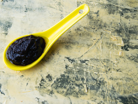 Flatlay, chocolate paste with nuts on a light background. Concept of calories and junk food.の写真素材