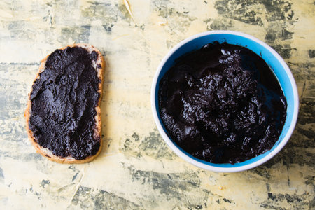 Flatlay, a delicious snack of white bread with chocolate paste on a light background.の写真素材