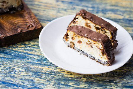 Delicious chocolate dessert, cheesecake with raisins and poppy seeds. Lviv cheesecake, a traditional Ukrainian dessert.の写真素材