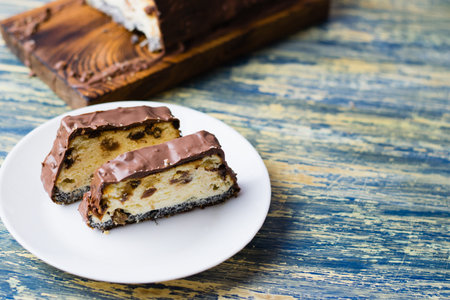 Delicious chocolate dessert, cheesecake with raisins and poppy seeds. Lviv cheesecake, a traditional Ukrainian dessert.の写真素材