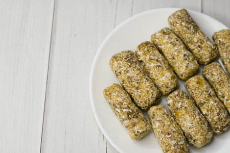 Delicious homemade sugar-free energy bars on plate. Diet and healthy eating concept