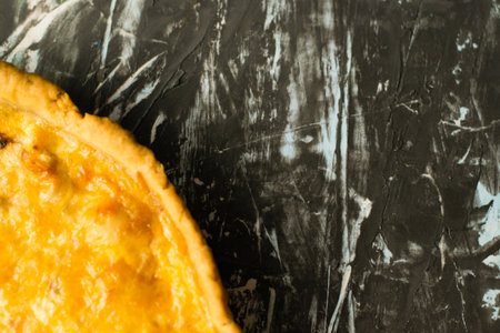 Flatlay, portion of delicious French quiche pie with chicken and cheese on dark background with place for text, copy space. Food blog concept, recipe writingの写真素材