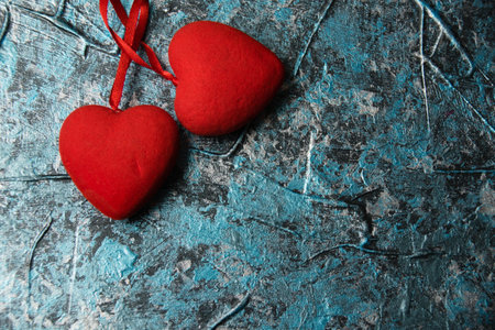 Valentine's Day, red hearts on a blue background.の写真素材