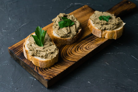 Healthy food, delicious and appetizing sandwiches with beef liver, parsley and fragrant baguette...