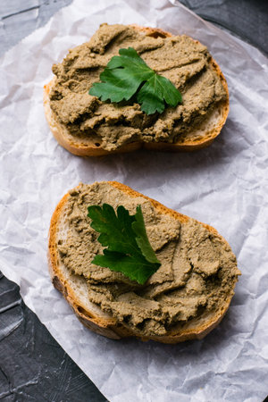 Healthy food, delicious and appetizing sandwiches with beef liver, parsley and aromatic baguette...