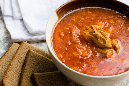 Delicious and aromatic red soup with meat, Ukrainian borscht. Traditional Ukrainian dish, cuisine.