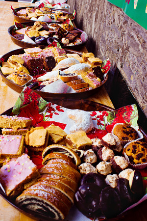 Traditional European Christmas sweets on food festival. Beautiful delicious pastries.の写真素材
