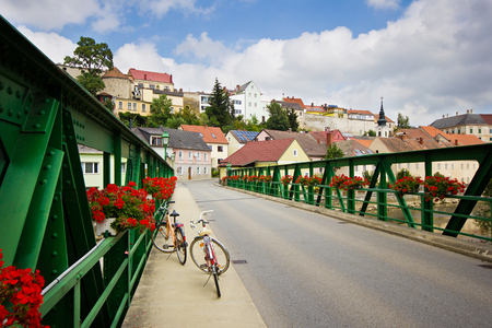 Cityscape of small pretty European town. A view on Waidhofen an der Thaya bridge with two bicycle on it, Austria.の写真素材