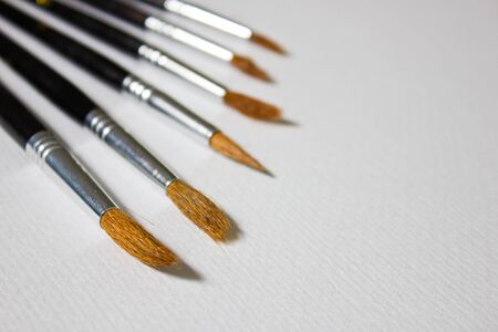 Still life with a set of watercolor painting. Paints, brushes and album with watercolor paper.の写真素材