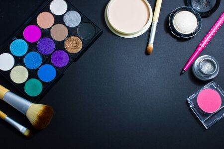 Set of professional cosmetics for make-up on black background. Cosmetic products for makeup.の写真素材