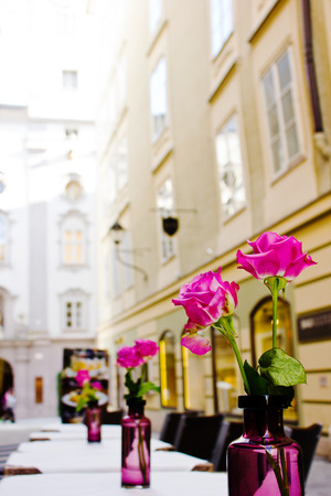 The summer platform of cafe on streets of old Salzburg, Austria. A romantic dinner at restaurant.の写真素材