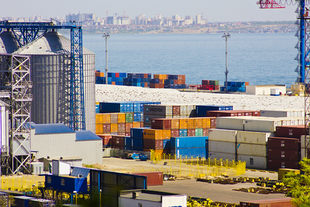 The port in the city of Odessa, Ukraine - May 4, 2017. Cargo containers in the port territory are unloaded by cranes from the ship. Seaport.のeditorial素材