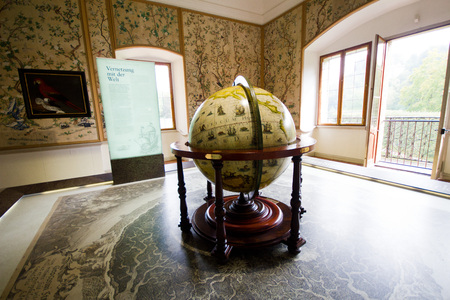 Salzburg, Austria/16 September 2016: Hellbrunn Palace - the globe in the room in the museum. The globe - a symbol of adventures and travelのeditorial素材