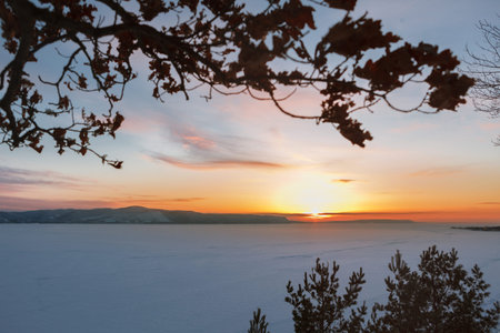 Color sunset over the river and mountainsの写真素材